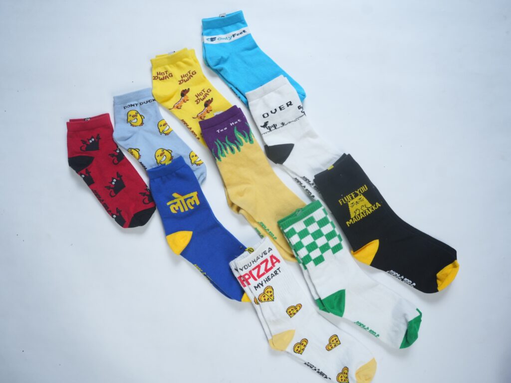 Feet Picks, led by marketer-turned-founder Jyothika Mary, began with a cheeky brand name and zero designs. After 1.5 years of testing and a self-filed patent, her SockLock button system is ready to make missing socks a thing of the past. The brand is now rolling out on Amazon, Myntra, and quick-commerce platforms. Orginal designs by Feet Picks